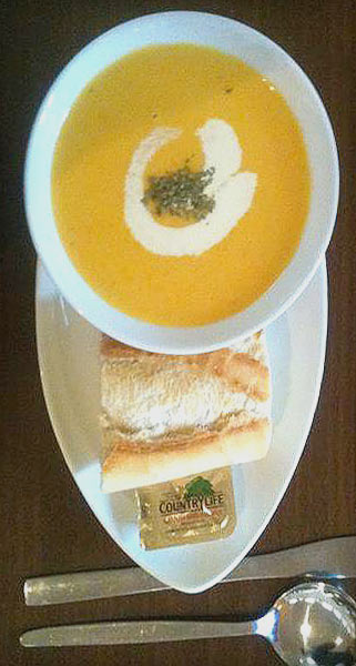 Parsnip soup of the day with crusty bread roll and butter